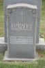 Headstone of Thomas P. Doyle,  Thomas C. Doyle and Jean E. Deloso.